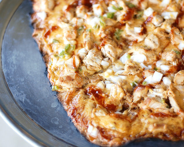 Finished pizza on a pan.