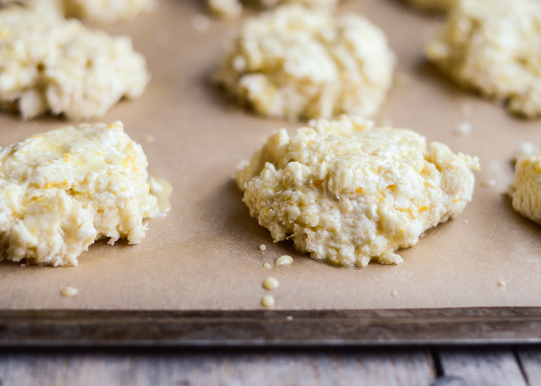 The scones resting on the prepared cookie sheet. 