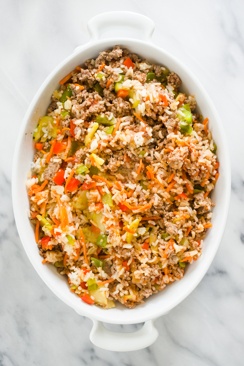 The filling part of the stuffed bell pepper casserole in a baking dish.