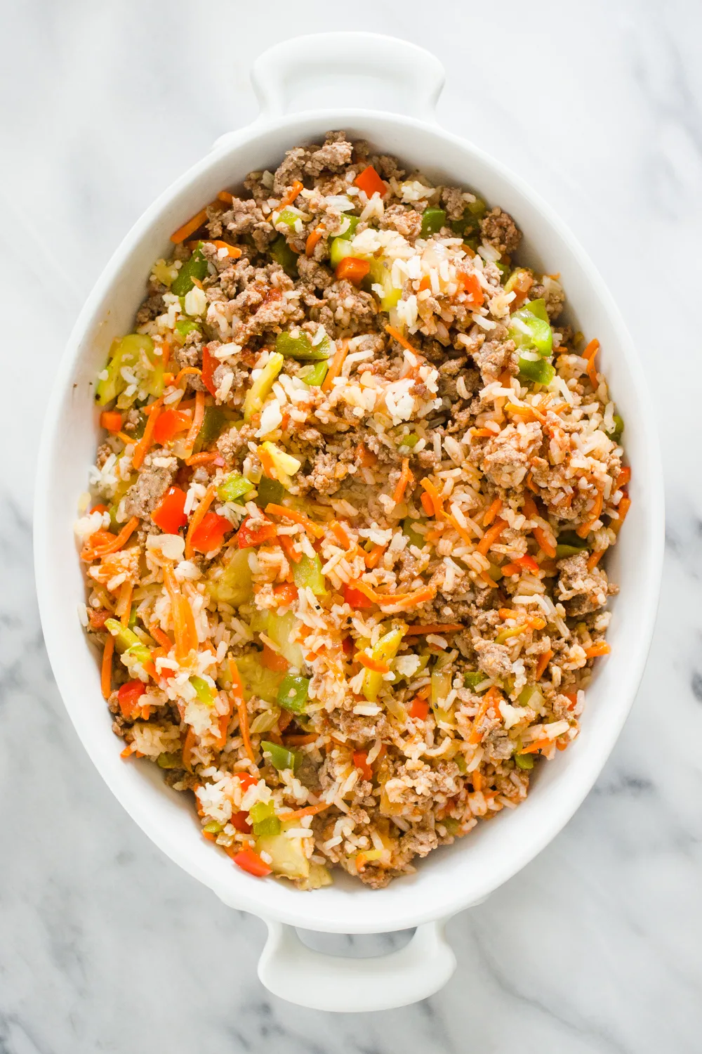 The filling part of the stuffed bell pepper casserole in a baking dish.