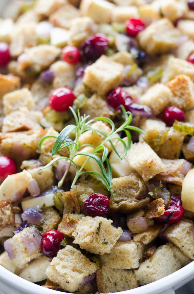 A close-up shot of the cranberry sourdough stuffing with fresh rosemary. 