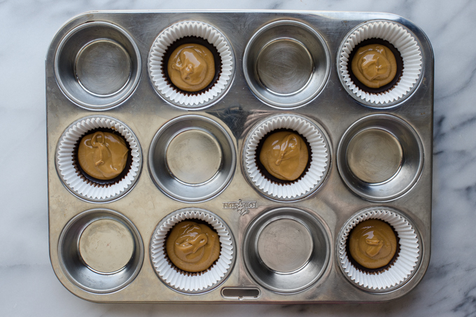 Dollops of peanut butter on top of the chocolate base.