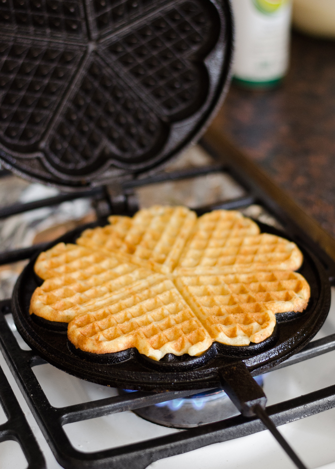 Cooking a waffle in a cast iron waffle iron.