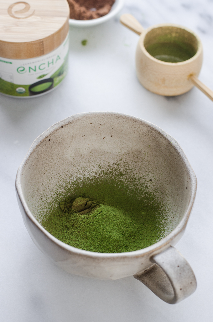 The sifted matcha and cocoa powder in a mug.