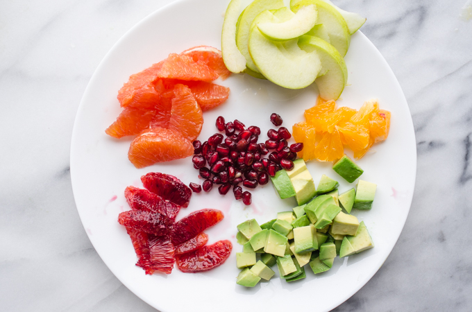 Winter Salad with Arugula, Avocado, Pomegranate, Blood Orange, and Apple