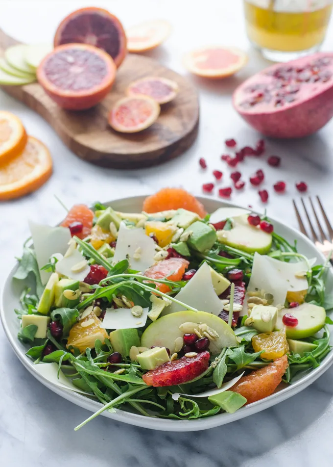 Winter Salad with Arugula, Avocado, Pomegranate, Blood Orange, and Apple