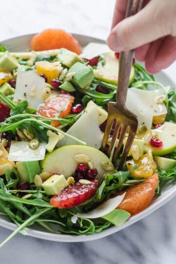 Winter Salad with Arugula, Avocado, Pomegranate, Blood Orange, and Apple
