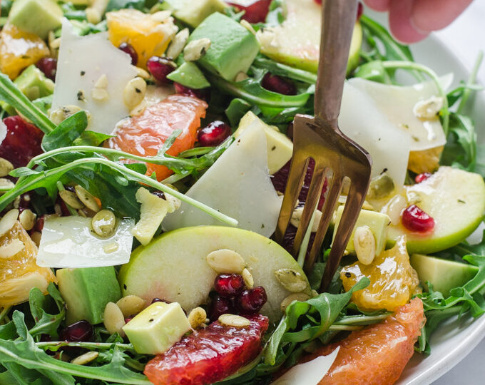 Winter Salad with Arugula, Avocado, Pomegranate, Blood Orange, and Apple