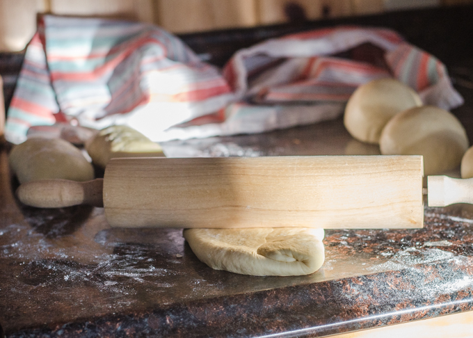 Rolling the dough again.