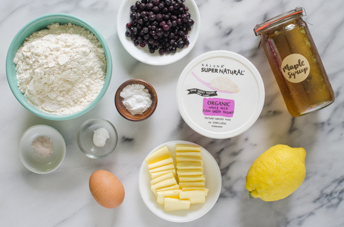 Ingredients for Greek yogurt scones from above on a marble surface.