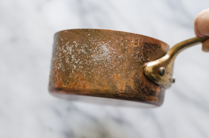 How to Polish Copper - Salt and ketchup on a tarnished copper pot.