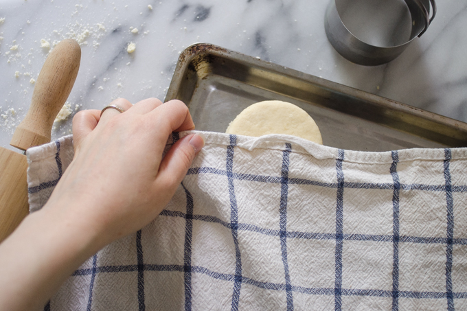 Covering the shortcakes while they rise.