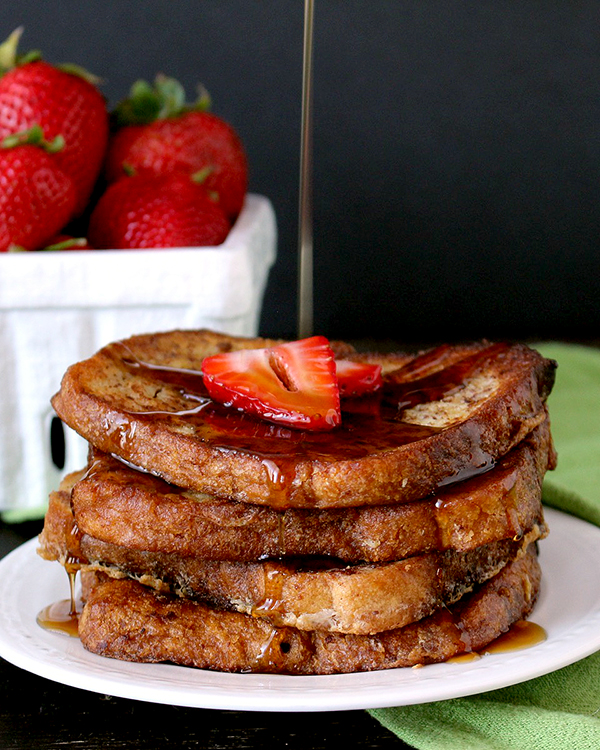 Coconut Oil French Toast with maple syrup being poured on top.