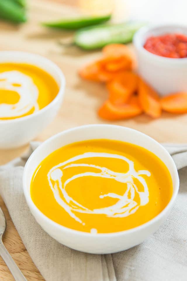 Bowl of Carrot Coconut Soup with drizzle.