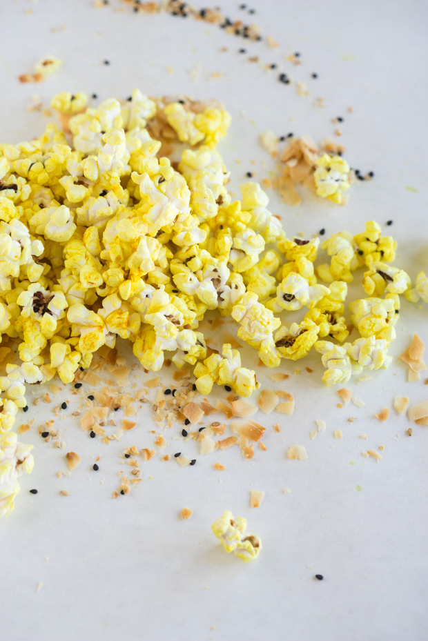 Turmeric popcorn on a light backbround.