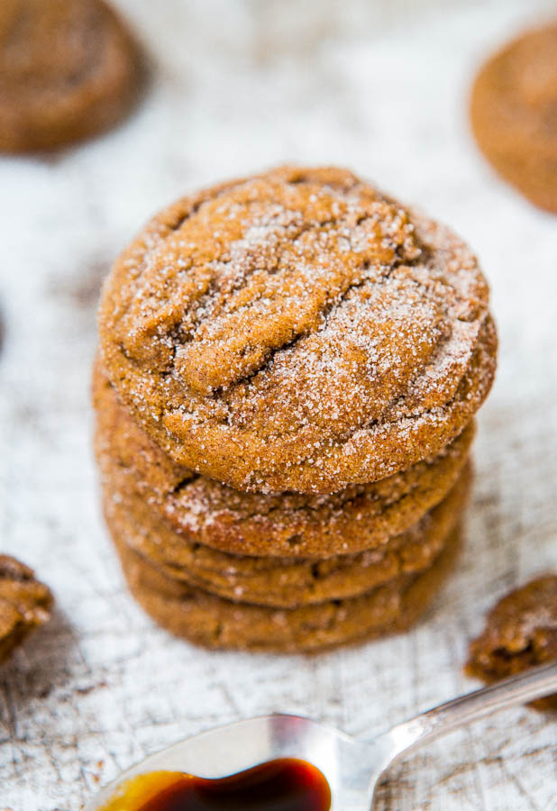 Stack of molasses spice cookies on a light background.