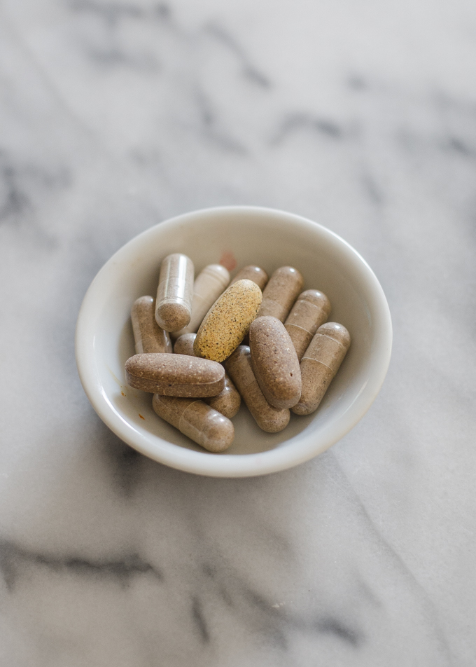 A small bowl filled with supplements.