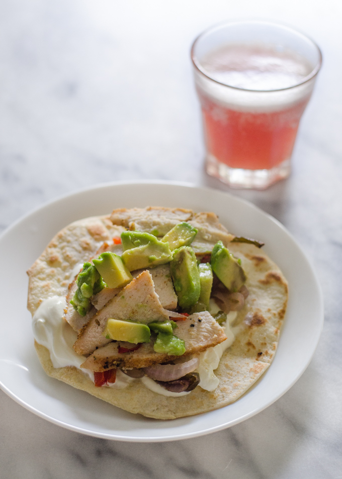 What I Ate Wednesday: supper! A chicken fajita with a glass of pink kombucha in the background.