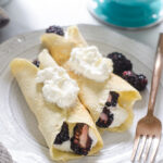 KETO crepes filled with whipped cream and blackberries.