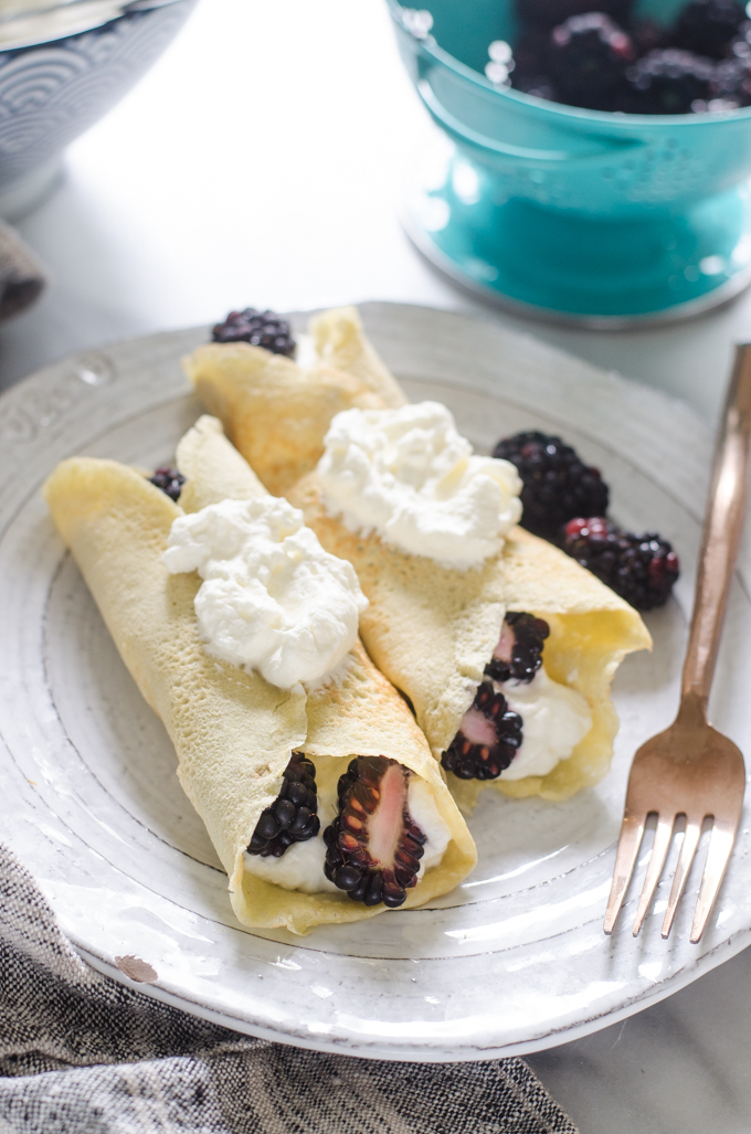 KETO crepes filled with whipped cream and blackberries.