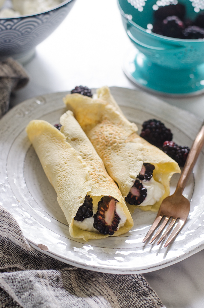 KETO crepes filled with whipped cream and blackberries.