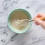 Whisking together the frosting ingredients.