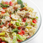 A large bowl of BLT bowtie pasta salad.