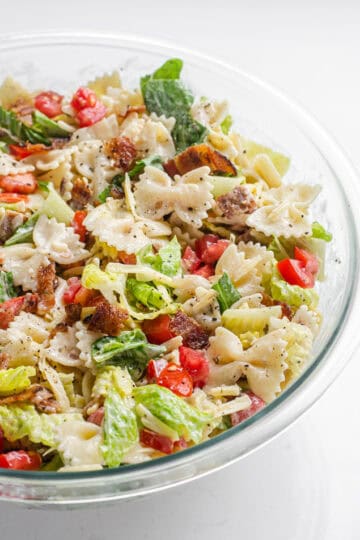 A large bowl of BLT bowtie pasta salad.