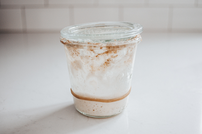 A crusty jar of sourdough starter that needs to be cleaned.