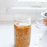 A glass fermentation weight for making sauerkraut.