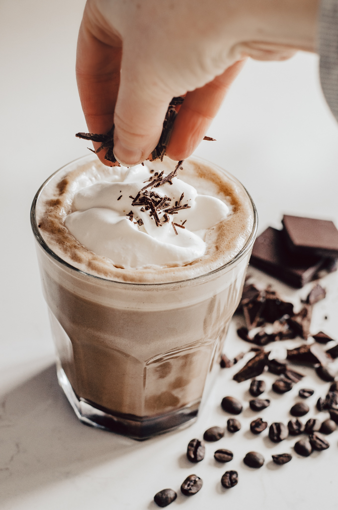 How to Make a Mocha Latte at Home: adding chopped chocolate on top of the whipped cream.