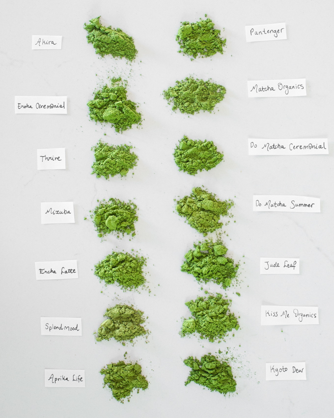 14 different organic fine green tea powder brands side by side for color comparison.
