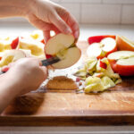 Coring the apples with a pairing knife.