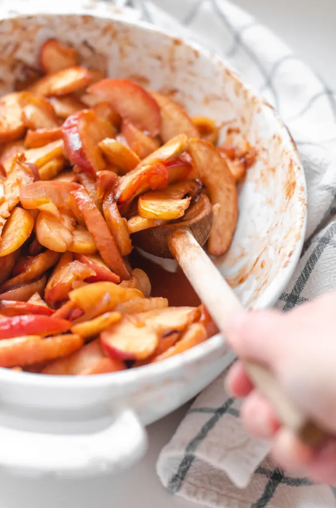 Scooping up some of the baked cinnamon apple slices. 