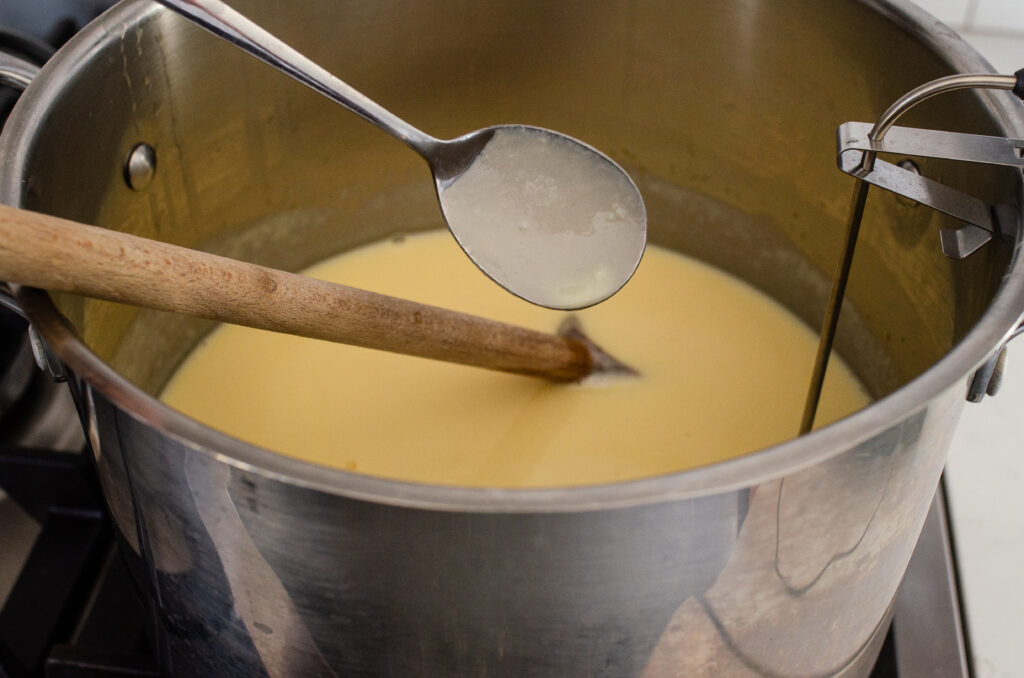 Photo of the eggnog custard coating the back of a spoon.