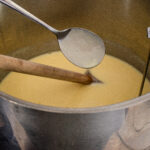 Photo of the eggnog custard coating the back of a spoon.