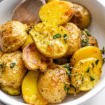 Elevated Roasted Little Potatoes with fresh herbs, lemon, garlic, and parmesan cheese.