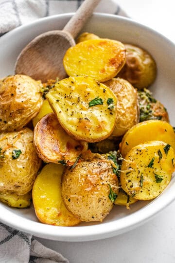 Elevated Roasted Little Potatoes with fresh herbs, lemon, garlic, and parmesan cheese.