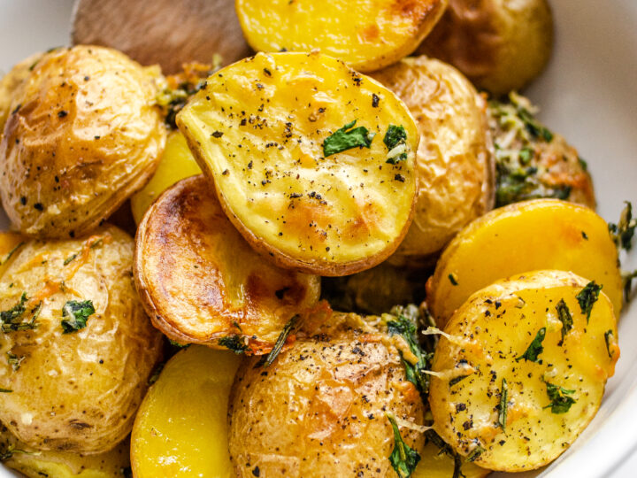 Elevated Roasted Little Potatoes with fresh herbs, lemon, garlic, and parmesan cheese.