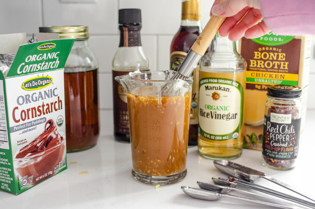 Whisking together the ingredients for the stir-fry sauce for a healthy chicken stir-fry. 