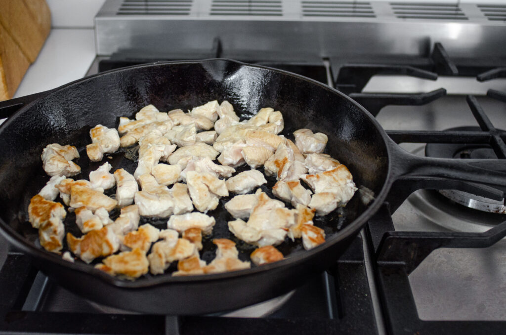 Cooking the chicken in a cast iron skillet for the stir fry. 