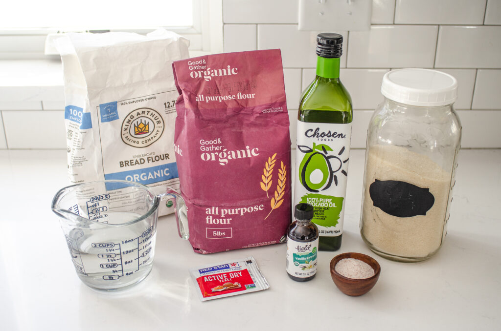 All of the ingredients needed to make cinnamon rolls without milk lined up on a counter. 