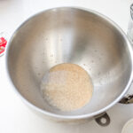 Activating the instant dry yeast in the bowl of a stand mixer.