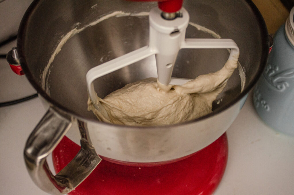 Kneading the sourdough pizza dough in a stand mixer. 