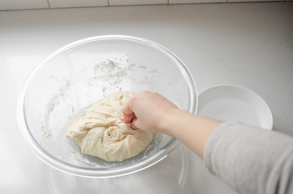 Pinching the salt into the dough.