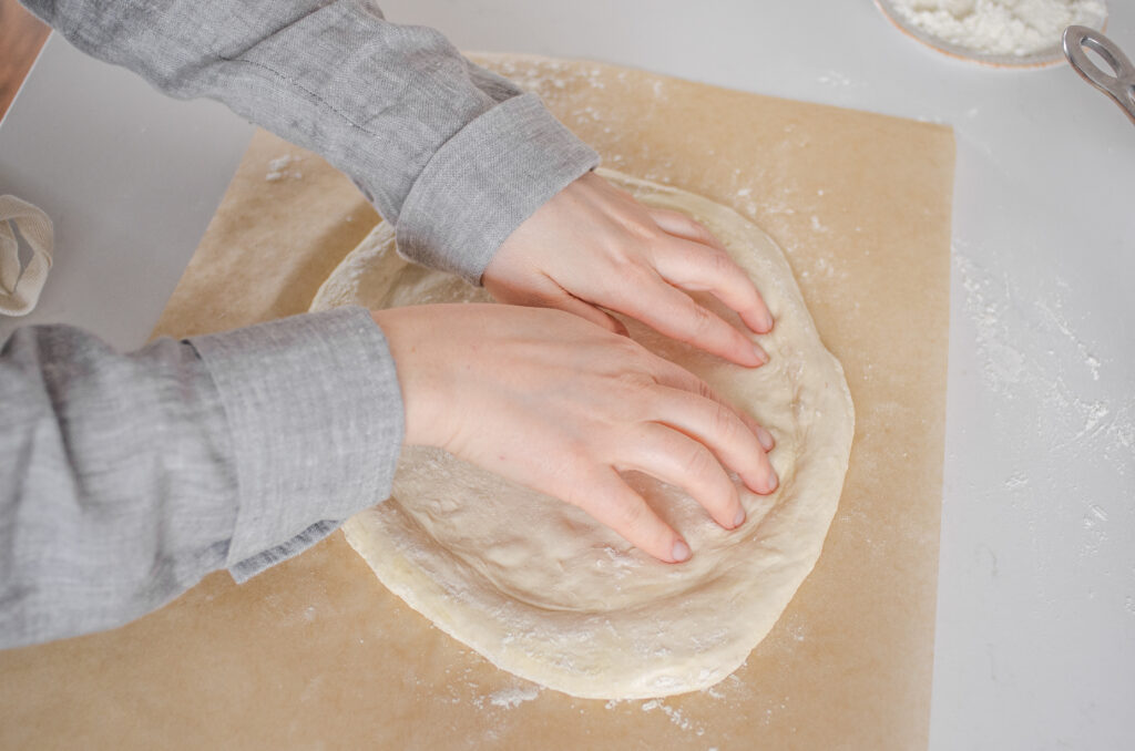 Shaping the dough after it's had a chance to rest.