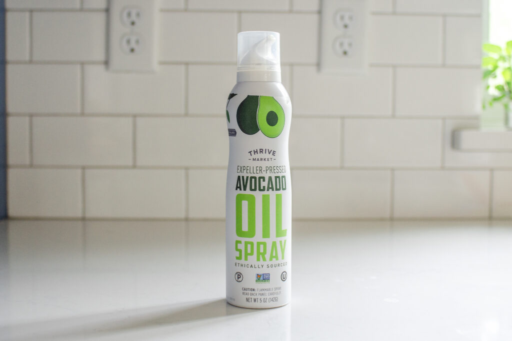 A can of avocado oil spray to be used in place of parchment paper to grease a pan for baking.