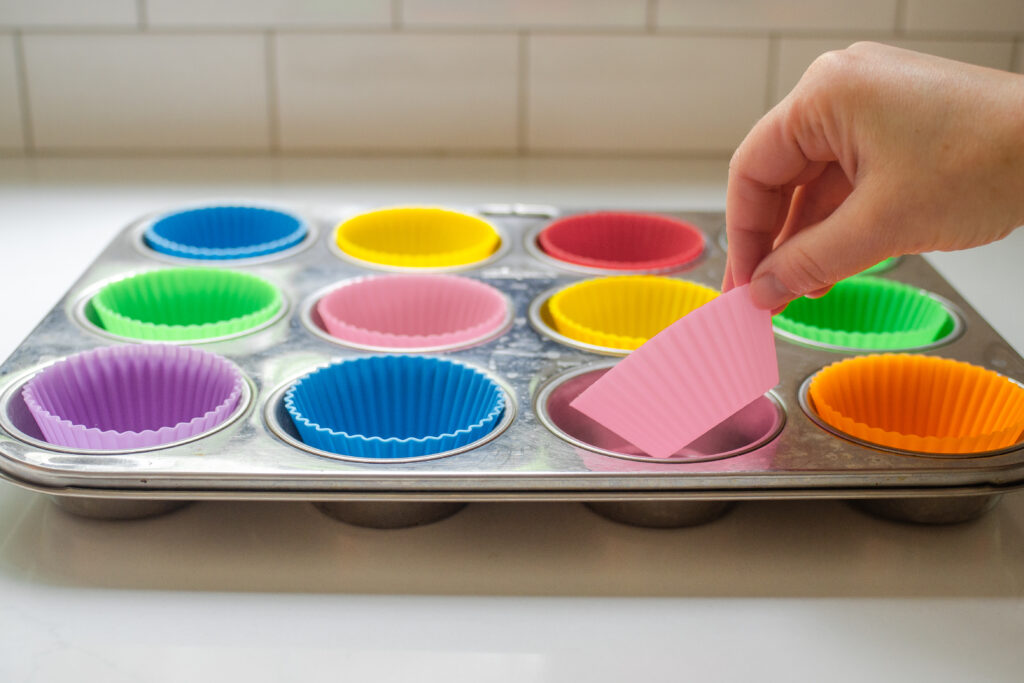 Lining a muffin pan with muffin liners instead of paper liners or parchment paper.