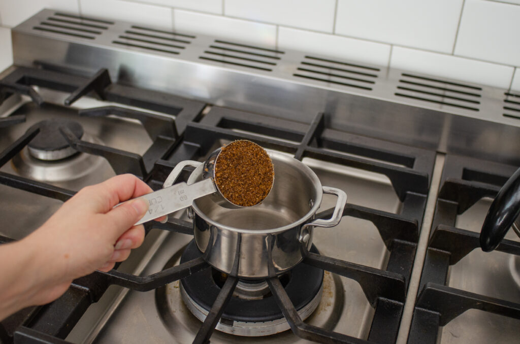 Adding the dark brown sugar to a small saucepan.