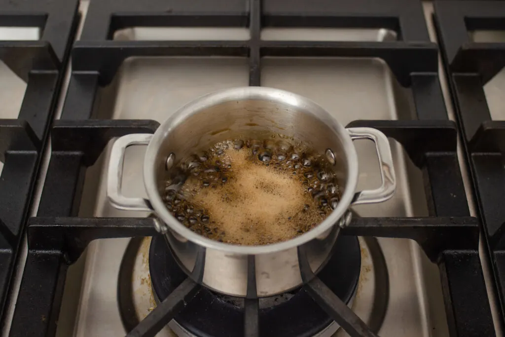 Boiling the brown sugar simple syrup.